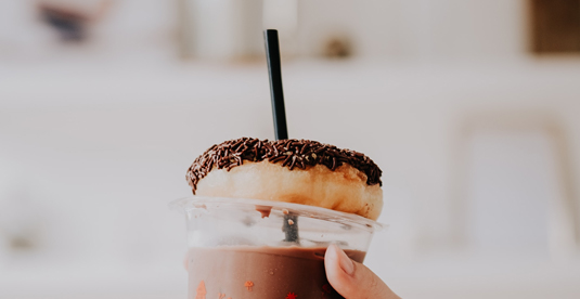 plastic straw and cup with donut