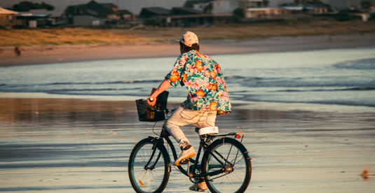 Man biking on a beach